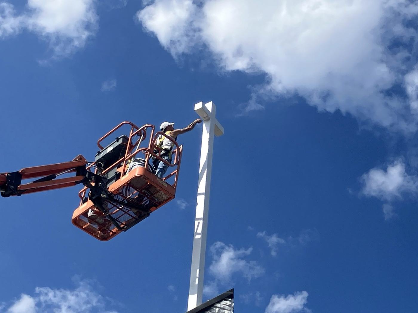 Spray GenX lift exterior painting